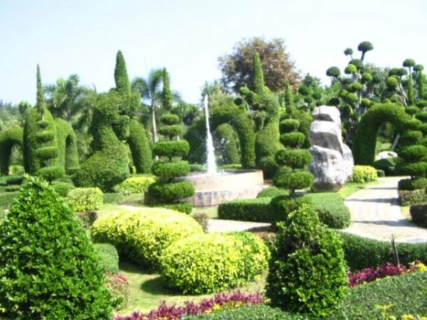 Tweechol Gardens 2 A fountain and tiered landscaped trees at Tweechol Botanic Gardens Horizon Village Resort Chiang Mai Thailand