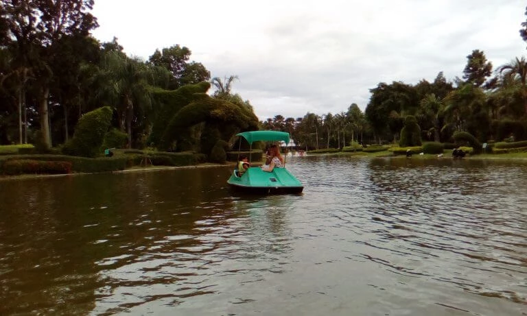 A mother and daughter out on a pedal boat on the lake at Horizon Resort Tweechol Garden Chiang Mai