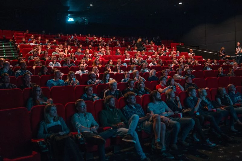 People watching a movie in theatre